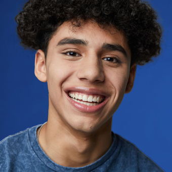 Image of smiling teen boy after Invisalign treatment - Busby & Webb Orthodontics | Salisbury, NC